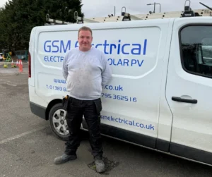 Mark 8 Trusted electrician near me standing in front of GSM Van